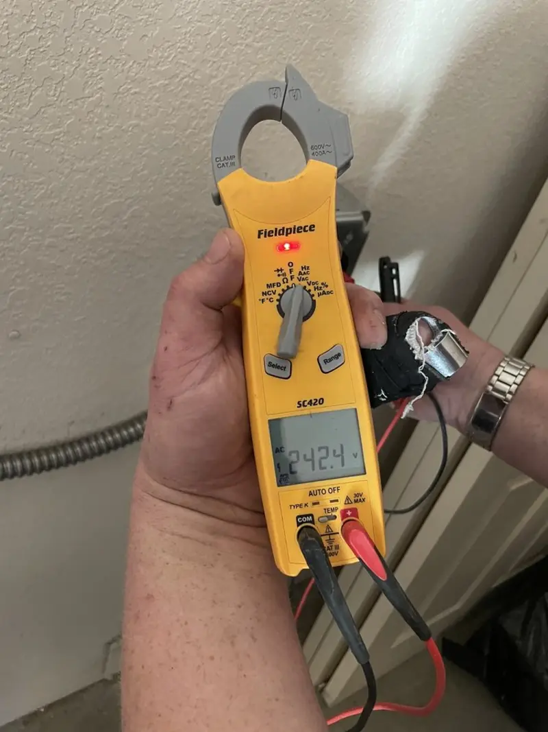 Voltage testing with clamp meter during Outlet Installation in Eagle